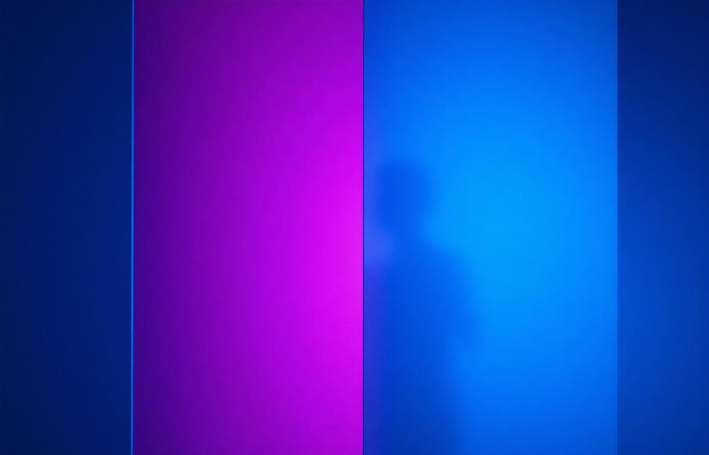 Abstract cyan and magenta light diffusing through frosted glass panels